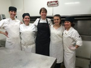 Courtney Younger (4th from left) is pictured with her colleagues at the Orchids at Palm Court.